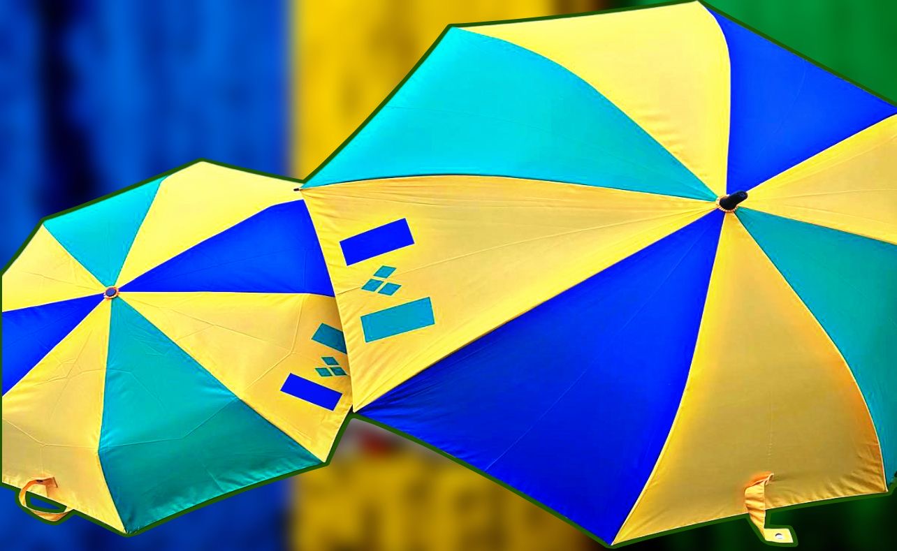 Bright St Vincent themed umbrella featuring yellow, blue, and turquoise panels, perfect for sunny or rainy days