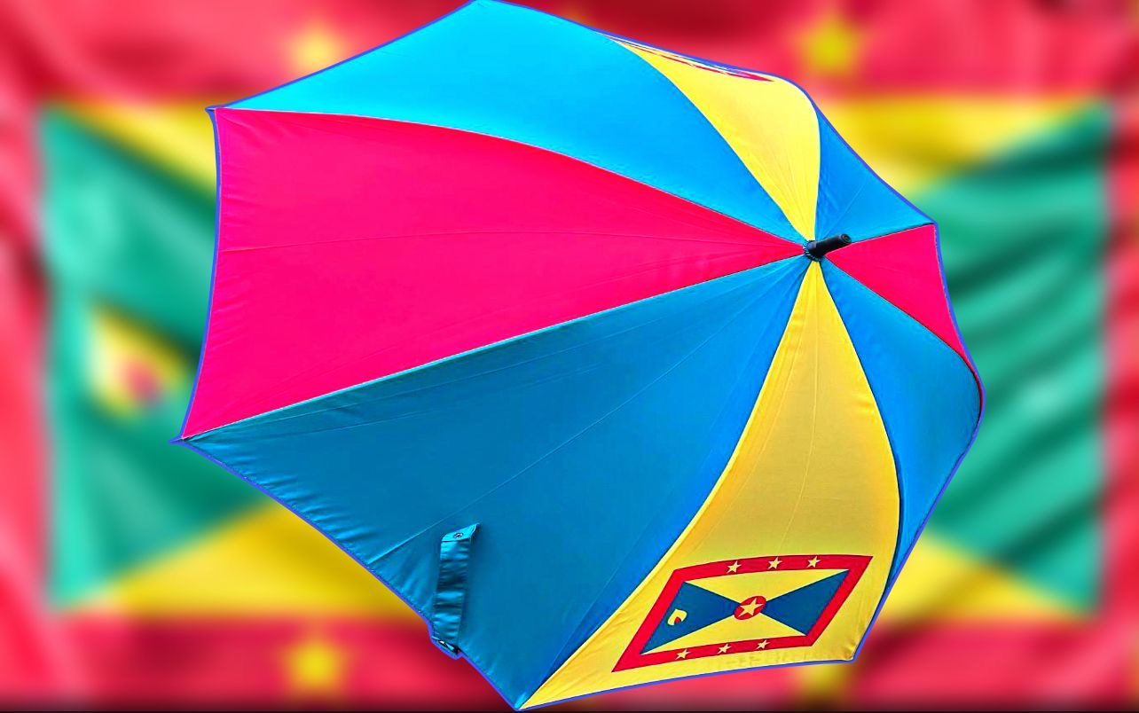 Large Grenada umbrella featuring vibrant colors of pink, blue, and yellow with the Grenadian flag design for stylish outdoor protection